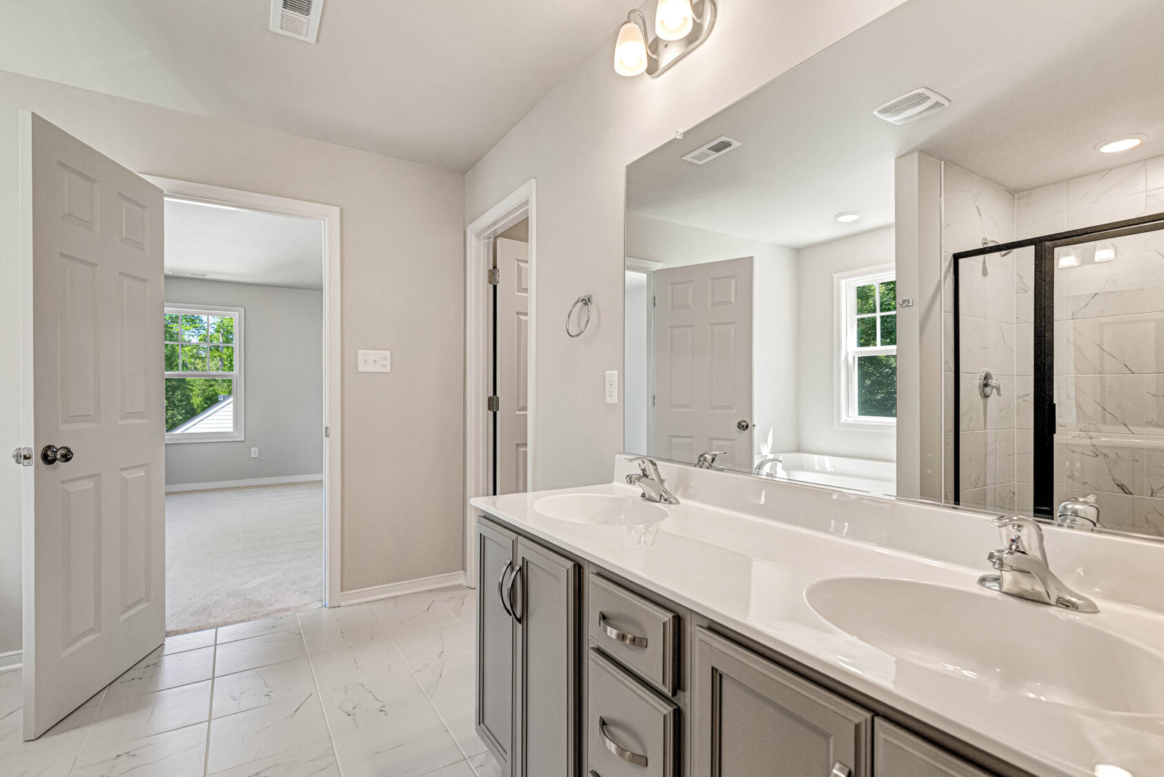 Bathroom in Somerset Hill with a double-sink vanity and a walk-in shower.